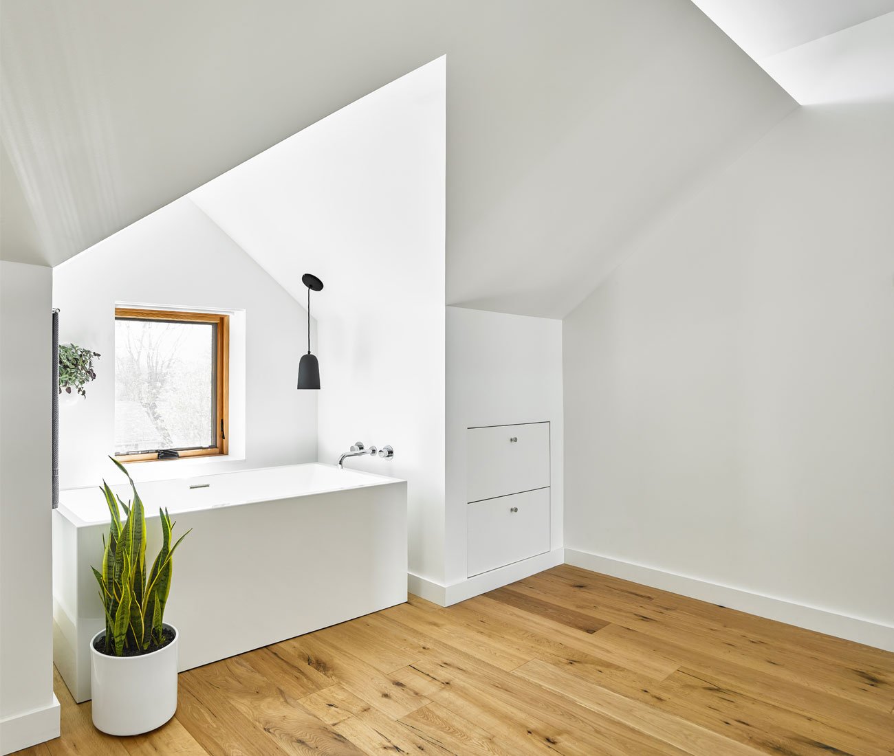 Bathtub on a Leslieville semi attic addition by Brian O’Brian Architect
