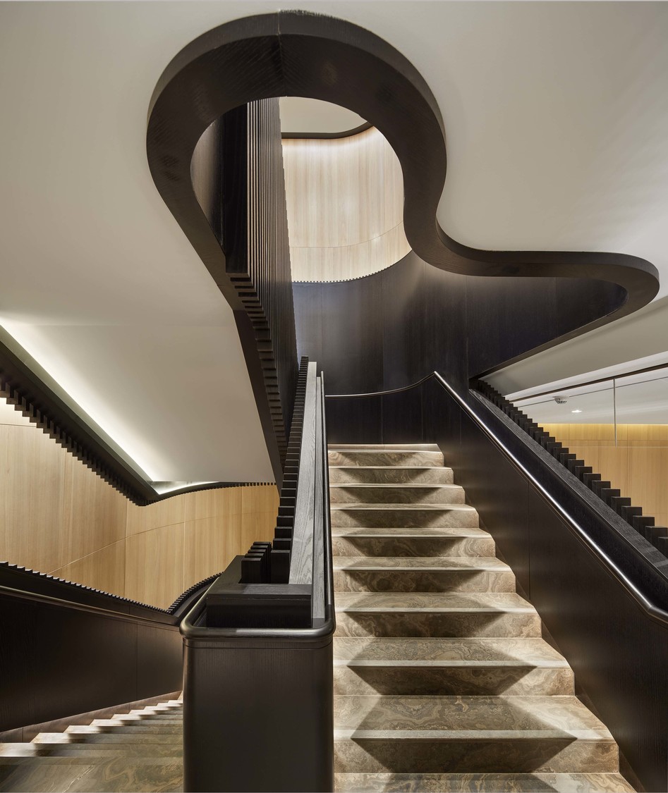 black feature staircase leading up to the second-storey hotel ballroom